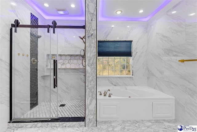 bathroom with a garden tub, a marble finish shower, ornamental molding, and tile walls