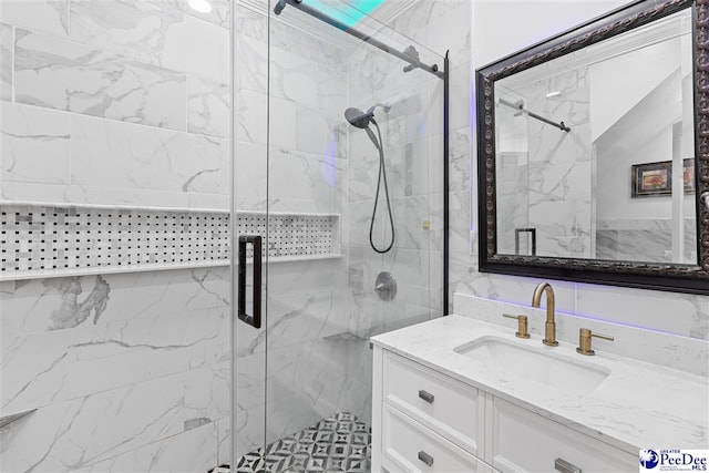 full bathroom with vanity and a marble finish shower