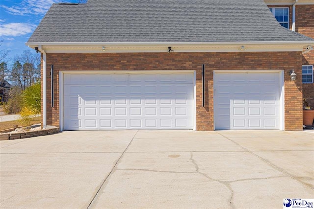 garage featuring driveway