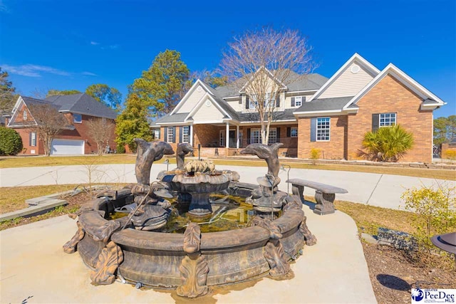 view of front of home featuring brick siding