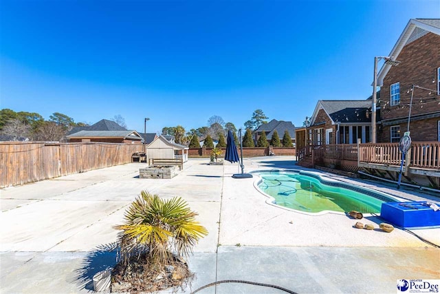 view of swimming pool featuring a fenced in pool, a patio area, and a fenced backyard