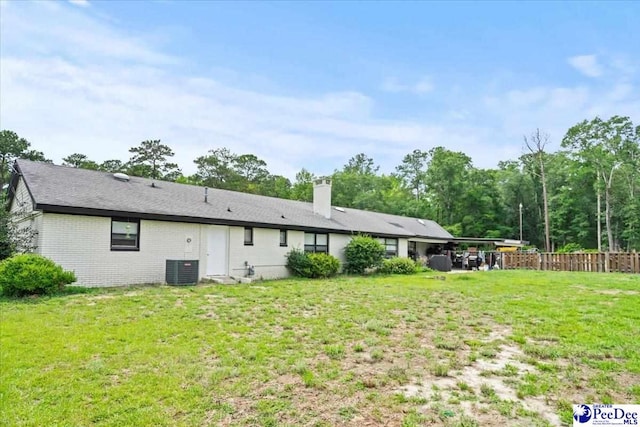 106 Min Lou Cir, Darlington, SC 29532 - back of property with a chimney, brick siding, and central AC unit