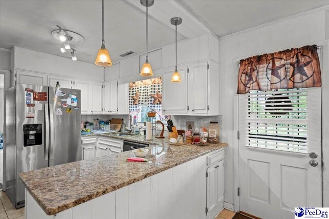 106 Min Lou Cir, Darlington, SC 29532 - kitchen with stainless steel appliances, a peninsula, white cabinetry, light stone counters, and pendant lighting