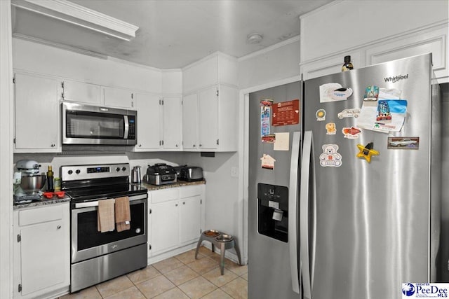 106 Min Lou Cir, Darlington, SC 29532 - kitchen with stainless steel appliances, light tile patterned flooring, and white cabinets
