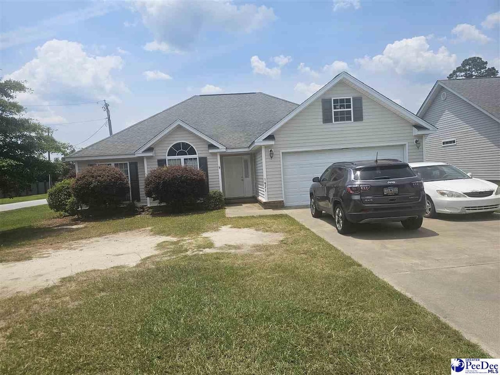 1621 Southwood Ct, Florence, SC 29505 - view of front of property featuring driveway, a front lawn, a shingled roof, and an attached garage