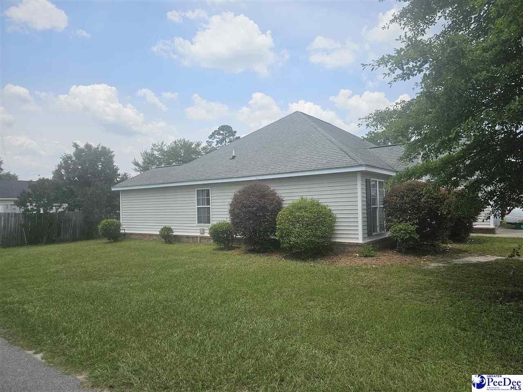 1621 Southwood Ct, Florence, SC 29505 - view of side of home featuring roof with shingles