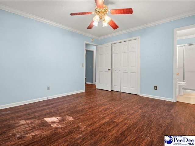 unfurnished bedroom with wood finished floors, a closet, ornamental molding, baseboards, and a ceiling fan