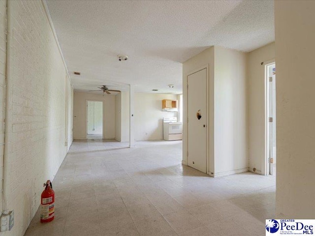 hallway featuring a textured ceiling