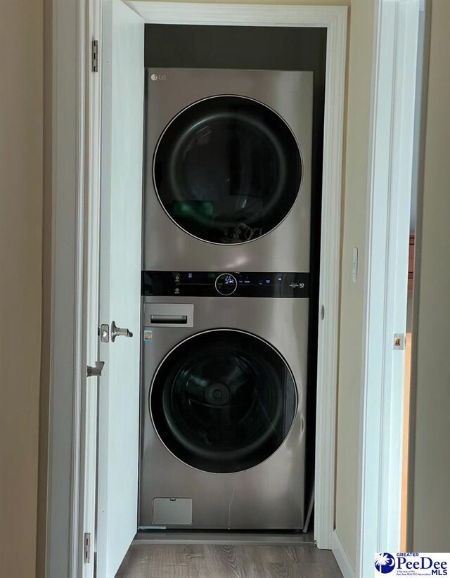 washroom with stacked washer and dryer