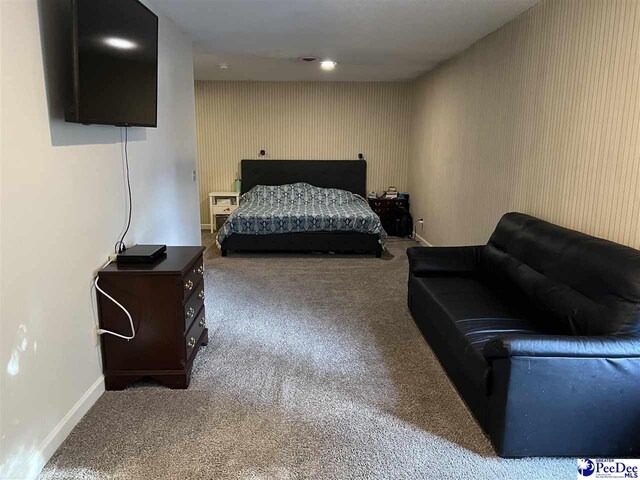 bedroom with carpet flooring and baseboards