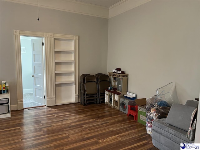 interior space featuring wood finished floors and crown molding