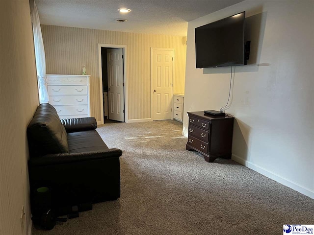 living area featuring carpet flooring, visible vents, and baseboards