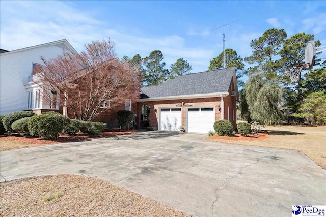 view of front of property with a garage, brick siding, roof with shingles, and driveway