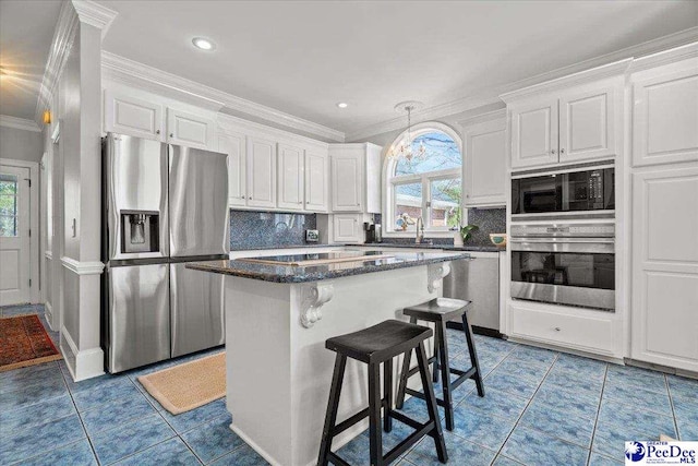 kitchen featuring black appliances, white cabinets, light tile patterned floors, and ornamental molding