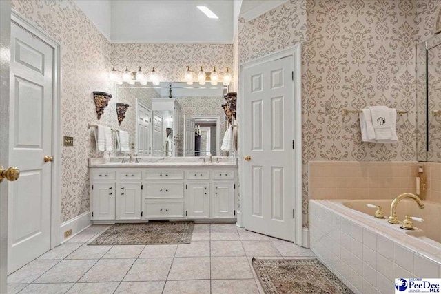 full bath featuring wallpapered walls, double vanity, tile patterned floors, and a sink