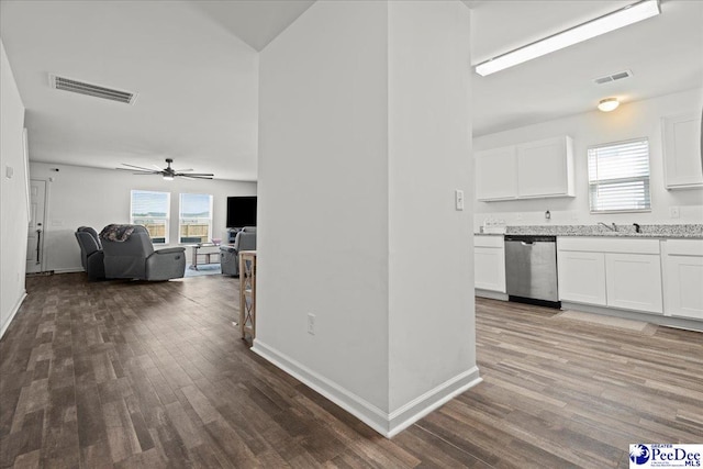 4080 Lake Russell Dr, Florence, SC 29501 - kitchen featuring stainless steel dishwasher, a ceiling fan, visible vents, and white cabinetry