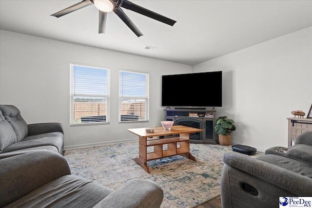 4080 Lake Russell Dr, Florence, SC 29501 - living area featuring visible vents, baseboards, and ceiling fan