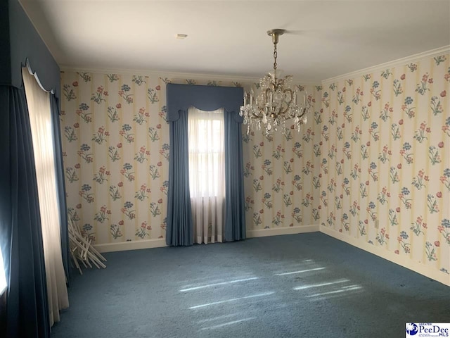 carpeted empty room featuring ornamental molding and a notable chandelier