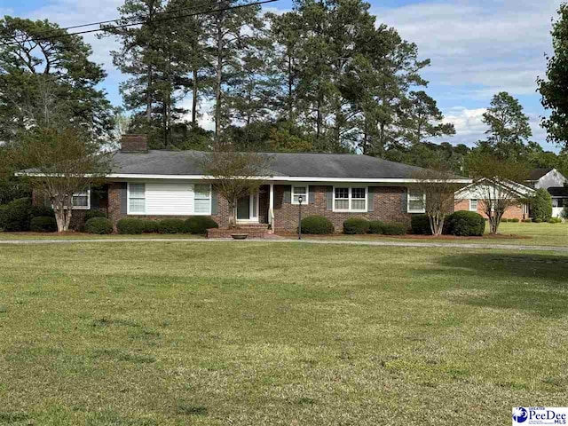 1600 Maple Dr, Dillon, SC 29536 - ranch-style home with a front yard