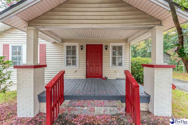 doorway to property with covered porch