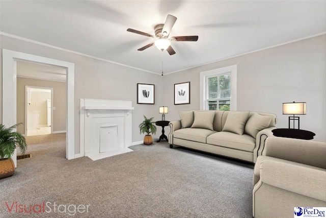 carpeted living room featuring ornamental molding and ceiling fan