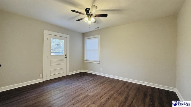 interior space featuring ceiling fan and dark hardwood / wood-style floors