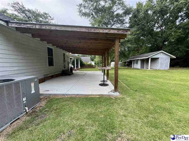 188 Chatham Trace Cir, Cheraw, SC 29520 - view of green lawn with a patio area and an outbuilding