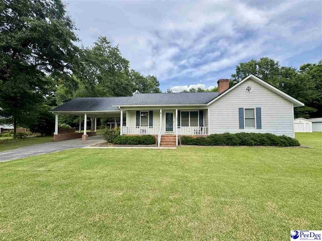 188 Chatham Trace Cir, Cheraw, SC 29520 - single story home with covered porch, a chimney, a front yard, an attached carport, and asphalt driveway