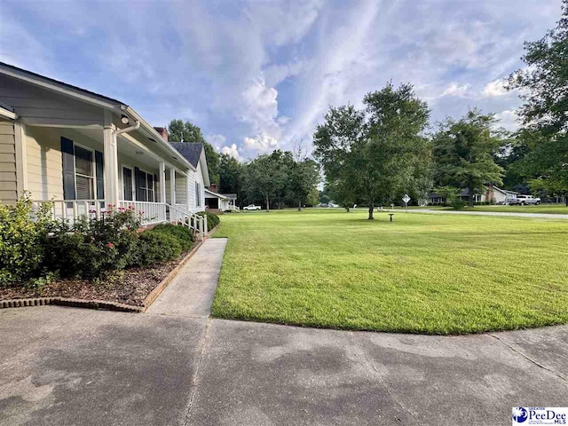 188 Chatham Trace Cir, Cheraw, SC 29520 - view of grassy yard with covered porch