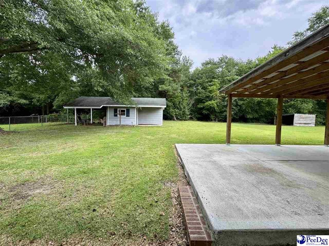 188 Chatham Trace Cir, Cheraw, SC 29520 - view of yard featuring an outdoor structure and a patio area