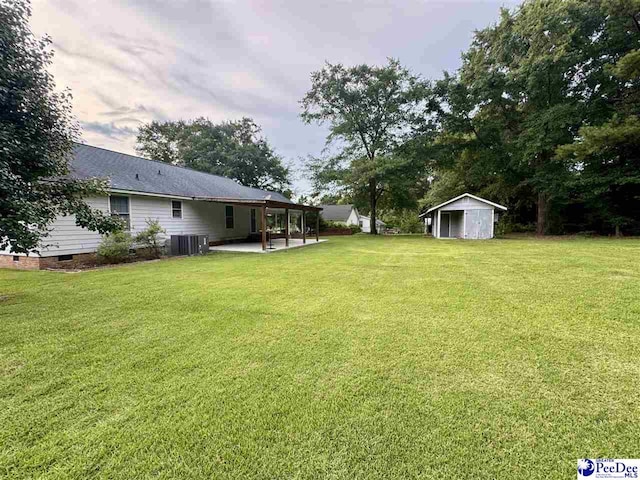 188 Chatham Trace Cir, Cheraw, SC 29520 - view of green lawn with a patio and a storage unit