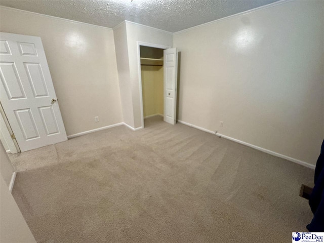 188 Chatham Trace Cir, Cheraw, SC 29520 - unfurnished bedroom featuring a textured ceiling, carpet flooring, and a closet