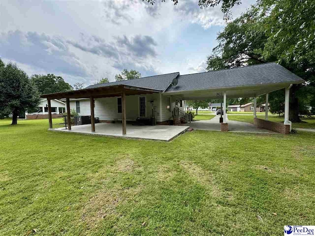 188 Chatham Trace Cir, Cheraw, SC 29520 - back of property with a lawn and a patio area