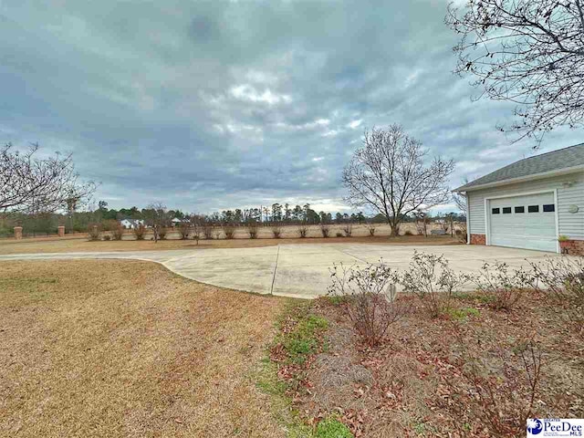 view of yard with a garage