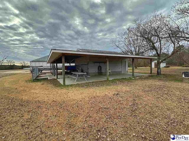 view of outbuilding with a lawn