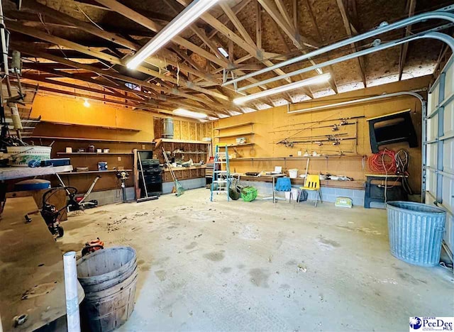 garage with a workshop area