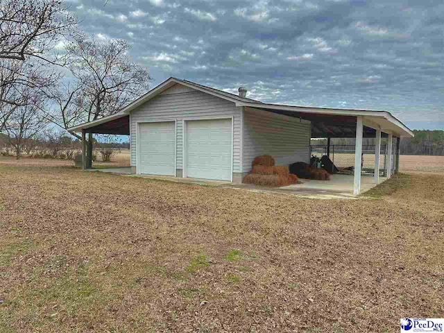 garage with a lawn