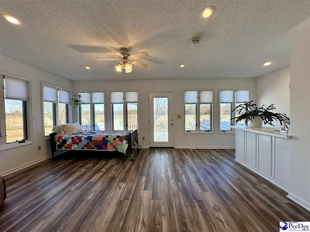 sunroom with sink, a wealth of natural light, and ceiling fan