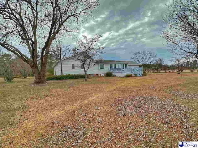 exterior space with a front lawn