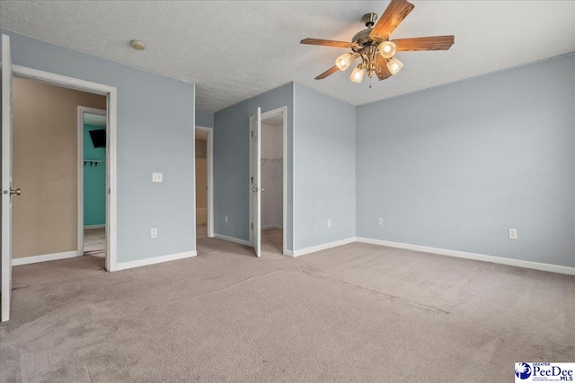 2770 Gray Dr, Darlington, SC 29532 - unfurnished bedroom featuring carpet, a spacious closet, ceiling fan, and a closet
