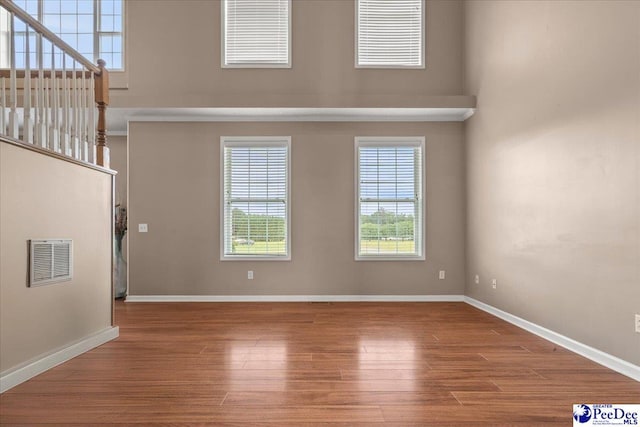 2770 Gray Dr, Darlington, SC 29532 - unfurnished living room featuring wood finished floors and stairway