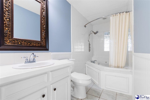 full bathroom featuring shower / bath combination with curtain, tile patterned flooring, vanity, toilet, and a textured ceiling