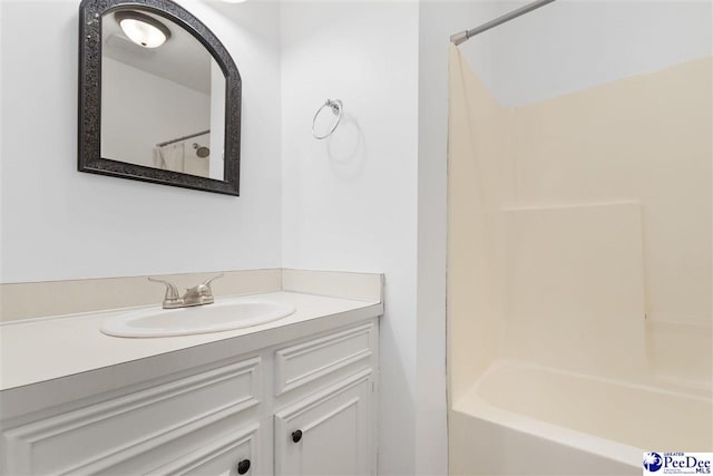 bathroom with vanity and bathtub / shower combination