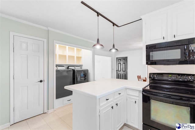 kitchen featuring white cabinetry, pendant lighting, washing machine and dryer, and black appliances