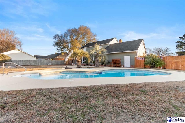 view of pool featuring an outdoor bar and a patio area