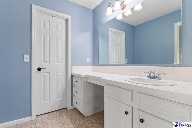 bathroom featuring vanity and a notable chandelier