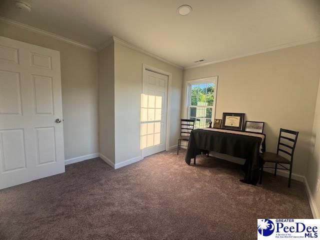 living area featuring ornamental molding, carpet floors, and baseboards