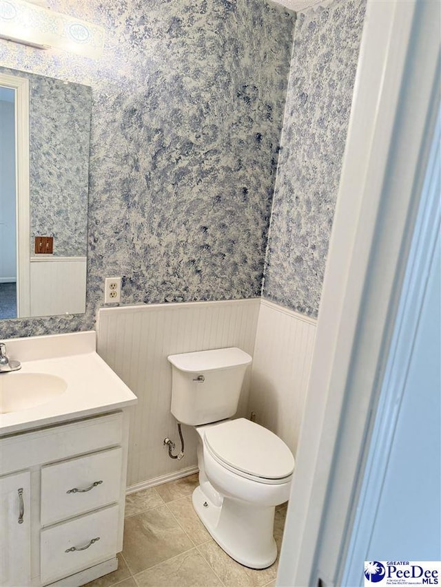 1801 E Howe Springs Rd, Florence, SC 29505 - half bath with wainscoting, vanity, and wallpapered walls