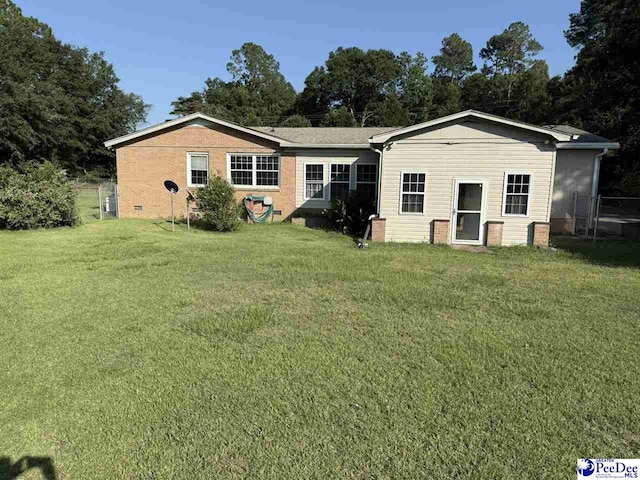 1801 E Howe Springs Rd, Florence, SC 29505 - back of property with a lawn