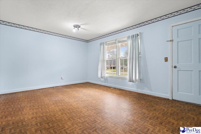 1216 Arrowood Dr, Florence, SC 29501 - unfurnished room with baseboards and a textured ceiling